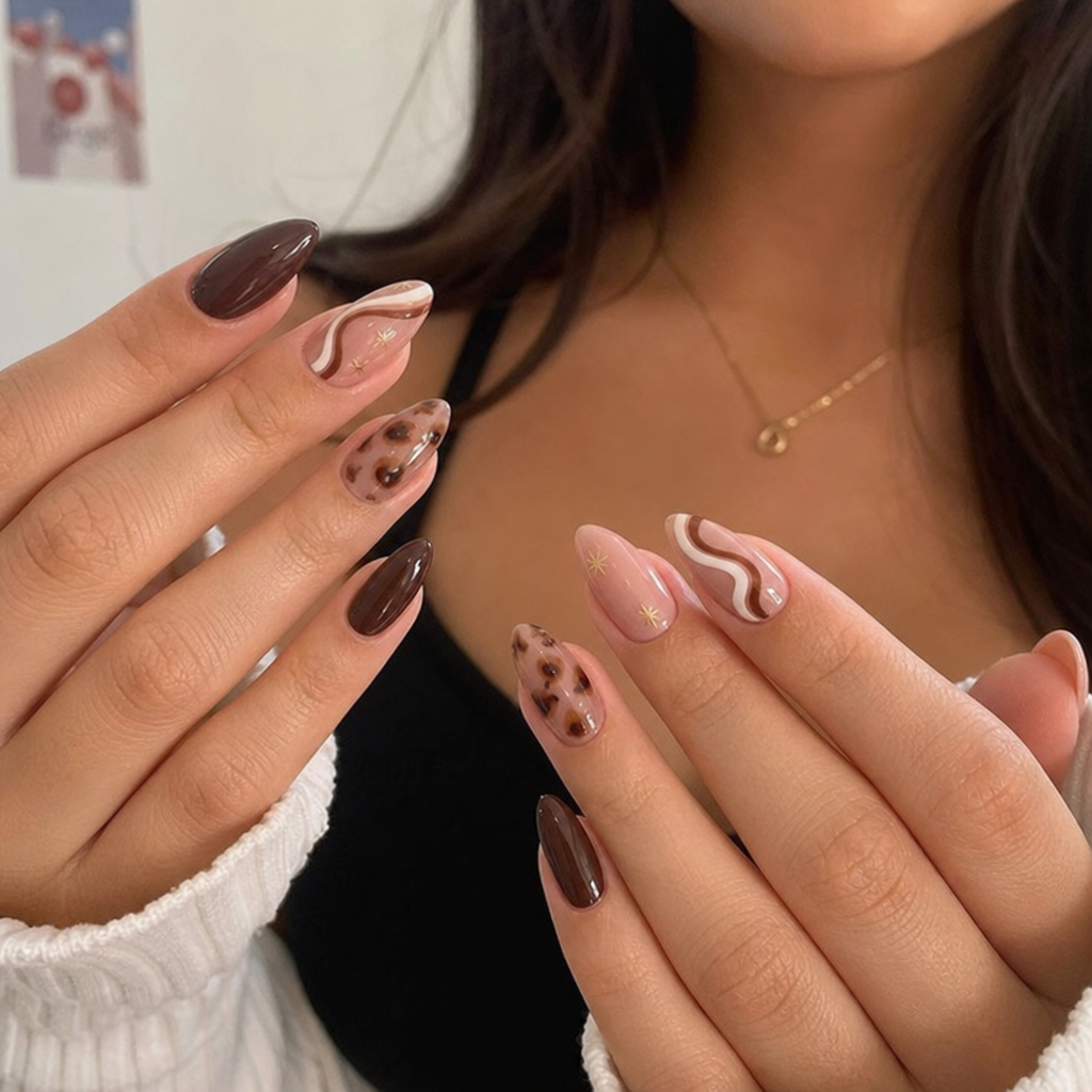 Woman with beautifully manicured hands showing off trendy nail designs
